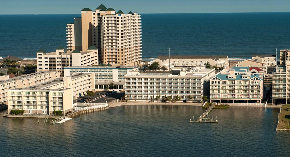 buildings on the beachside, photo taken from the water