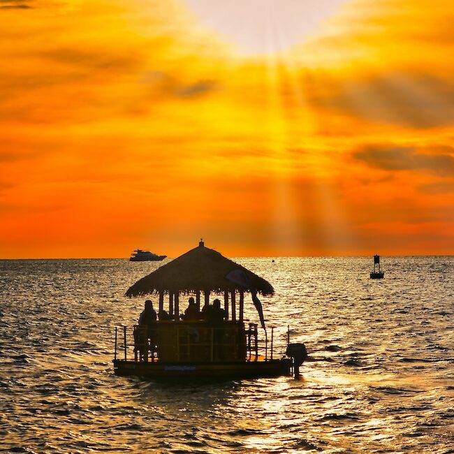 tiki boat during sunset